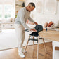 Dad cleaning tray of UPPAbaby CIRO High Chair - JAKE (Charcoal)