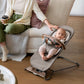 Baby sitting in Mira Bouncer with UPPAbaby Forest Fun Toy Bar - MIRA accessory attached