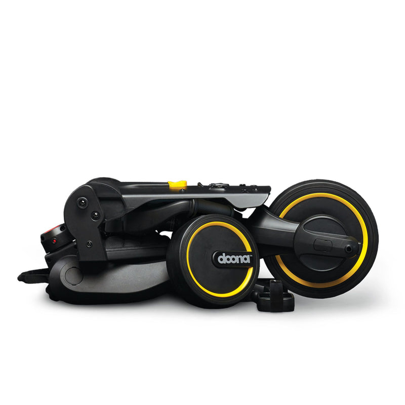 Doona Liki Trike folded to carry-on size — fits airline overhead bin and car trunk