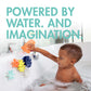 Little boy plays with Boon COGS Building Bath Toy Set - Navy / Yellow