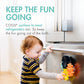 Child plays with Boon COGS Building Bath Toy Set - Navy / Yellow on the fridge