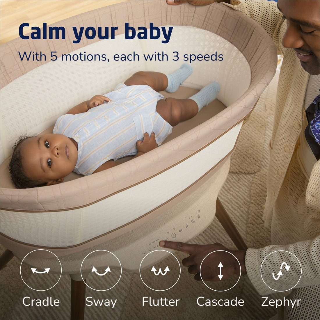 Dad adjusts settings for baby lying in Maxi-Cosi Starling Smart Bassinet - Natural Heritage
