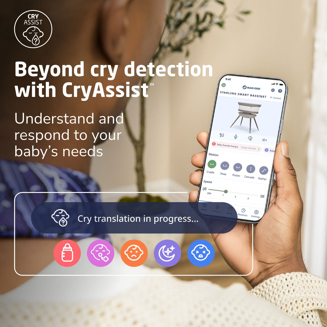 Dad checks cryassist of Maxi-Cosi Starling Smart Bassinet - Natural Heritage on his phone