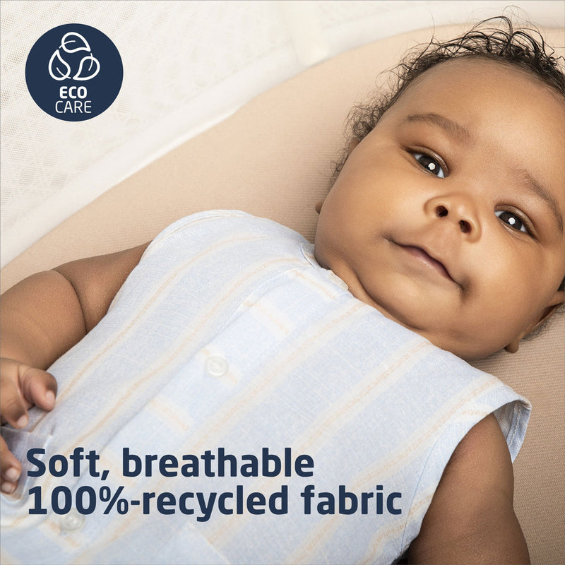 Baby lying in Maxi-Cosi Starling Smart Bassinet - Natural Heritage