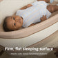 Baby lying in Maxi-Cosi Starling Smart Bassinet - Natural Heritage