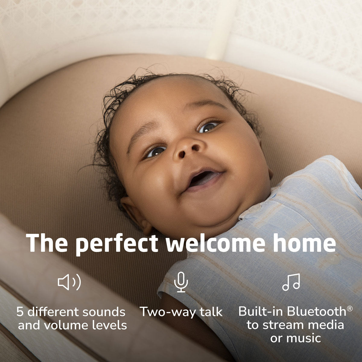 Baby lying in Maxi-Cosi Starling Smart Bassinet - Natural Heritage