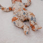 Baby girl wearing Copper Pearl Zip-up Footie - Eden