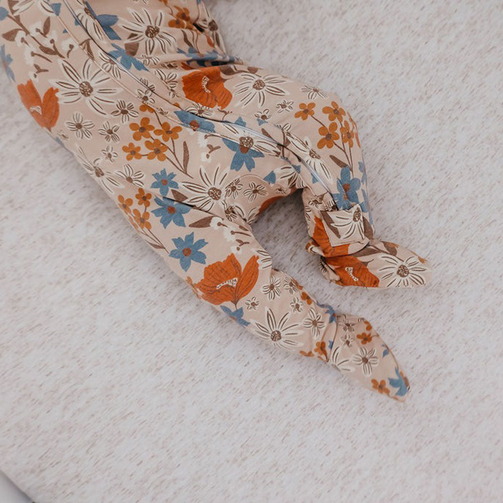 Baby girl wearing Copper Pearl Zip-up Footie - Eden