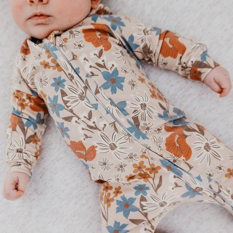 Baby girl wearing Copper Pearl Zip-up Footie - Eden