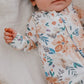 Baby girl wearing Copper Pearl Zip-up Footie - Autumn