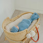Baby wrapped in Copper Pearl Rib Knit Swaddle Blanket - Atlantic