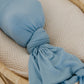 Baby wrapped in Copper Pearl Rib Knit Swaddle Blanket - Atlantic