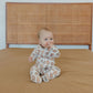 Baby wearing Copper Pearl Zip-up Footie - Blitz