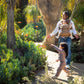 Mom goes on walk with daughter while carrying baby in Mom carrying baby in Nuna CUDL Luxe Carrier - Canyon
