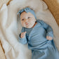 Baby girl wearing Copper Pearl Rib Knit Newborn Knotted Gown - Atlantic