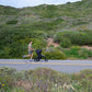 Dad goes for a run while pushing child in Bumbleride 2024 Speed Jogging Stroller - Black