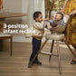 Child smiles at baby sitting in Maxi-Cosi Kiskadee 360 Rotating Highchair - Natural Heritage