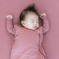 Baby sleeps while wearing Kyte Baby Sleep Bag - Dusty Rose - 2.5 Tog
