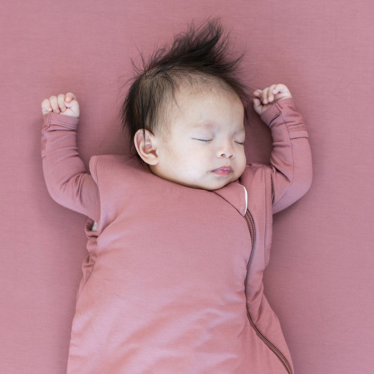 Baby sleeps while wearing Kyte Baby Sleep Bag - Dusty Rose - 2.5 Tog