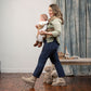 Mom carries baby forward facing in Nuna CUDL Luxe Carrier - Canyon