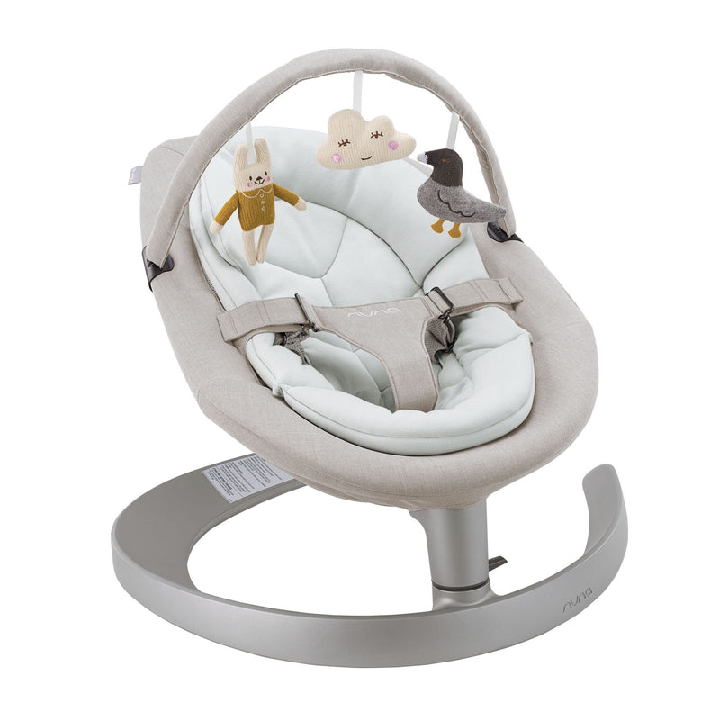 Girls sits in Nuna LEAF Grow - Driftwood