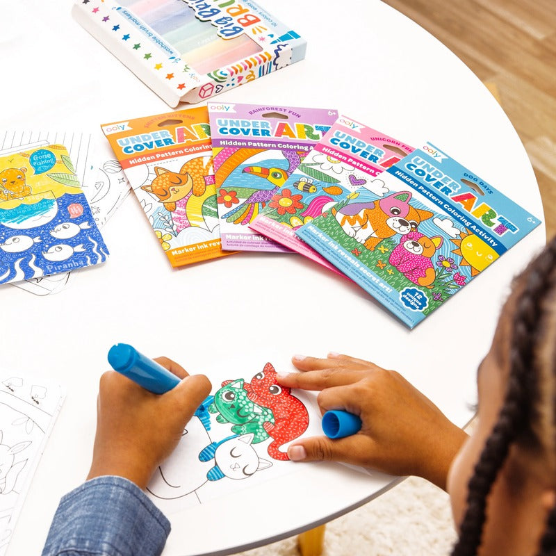 Little girl coloring OOLY  Undercover Art Hidden Pattern Coloring Activity Art Cards - Dog Days