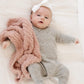 Baby laying with Saranoni Receiving Ribbed Bamboni Blanket - Cameo
