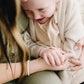 Little girl and mom wearing matching Joyful Bead Company Fancy Pearl Bracelet