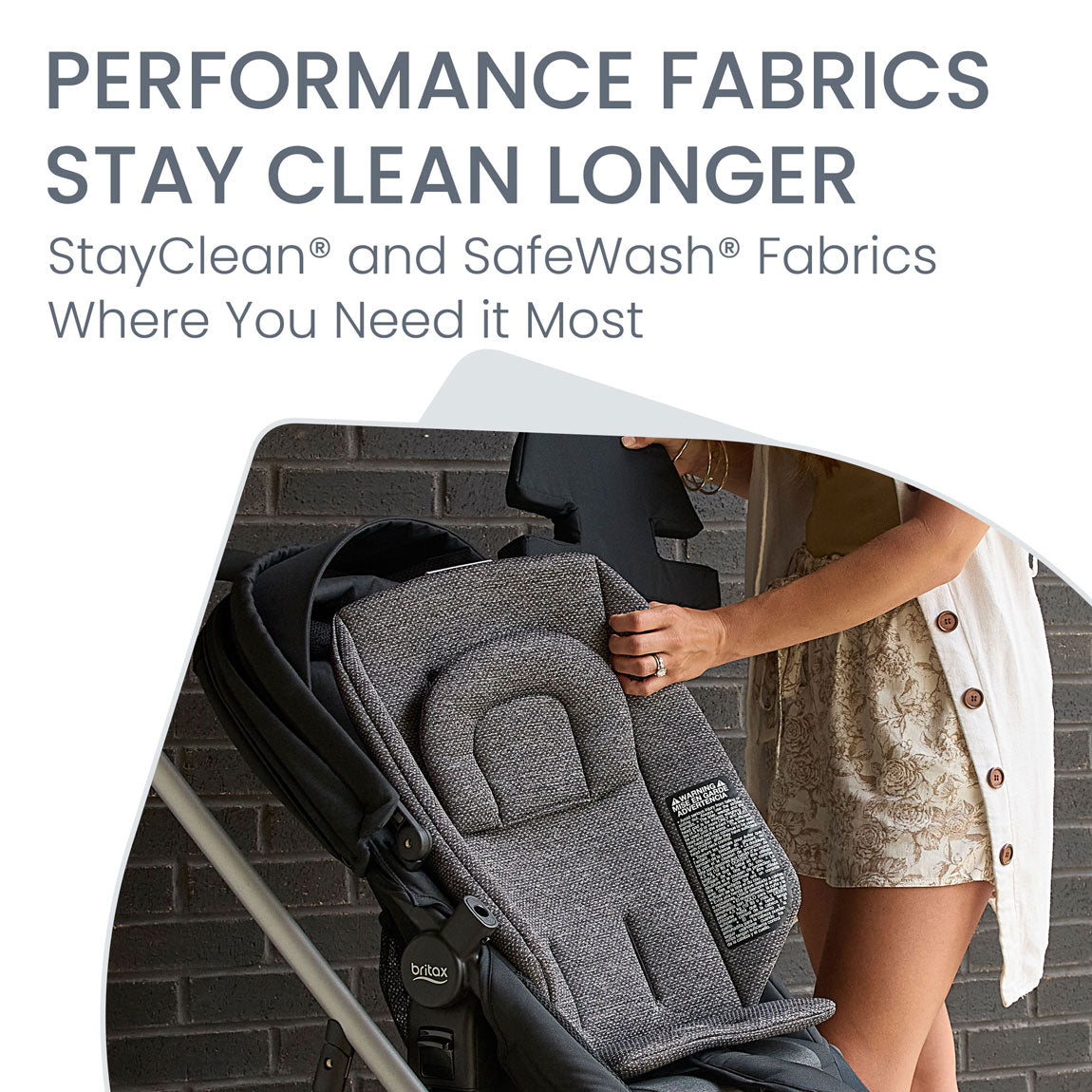 Mom cleans fabric of Britax Grove Modular Stroller - Pindot Onyx