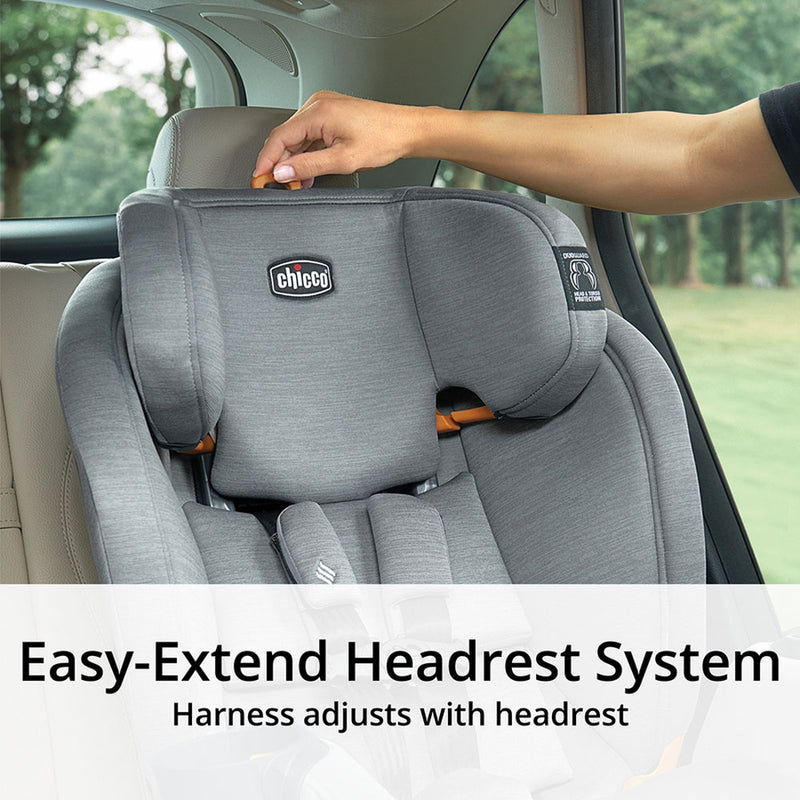 Mom adjust headrest of Chicco OneFit ClearTex All-In-One Car Seat - Drift
