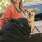 Woman carrying small dog in Tavo Maeve + Roscoe 3-in-1 Pet Protection System - Small Flex - Onyx with shoulder strap