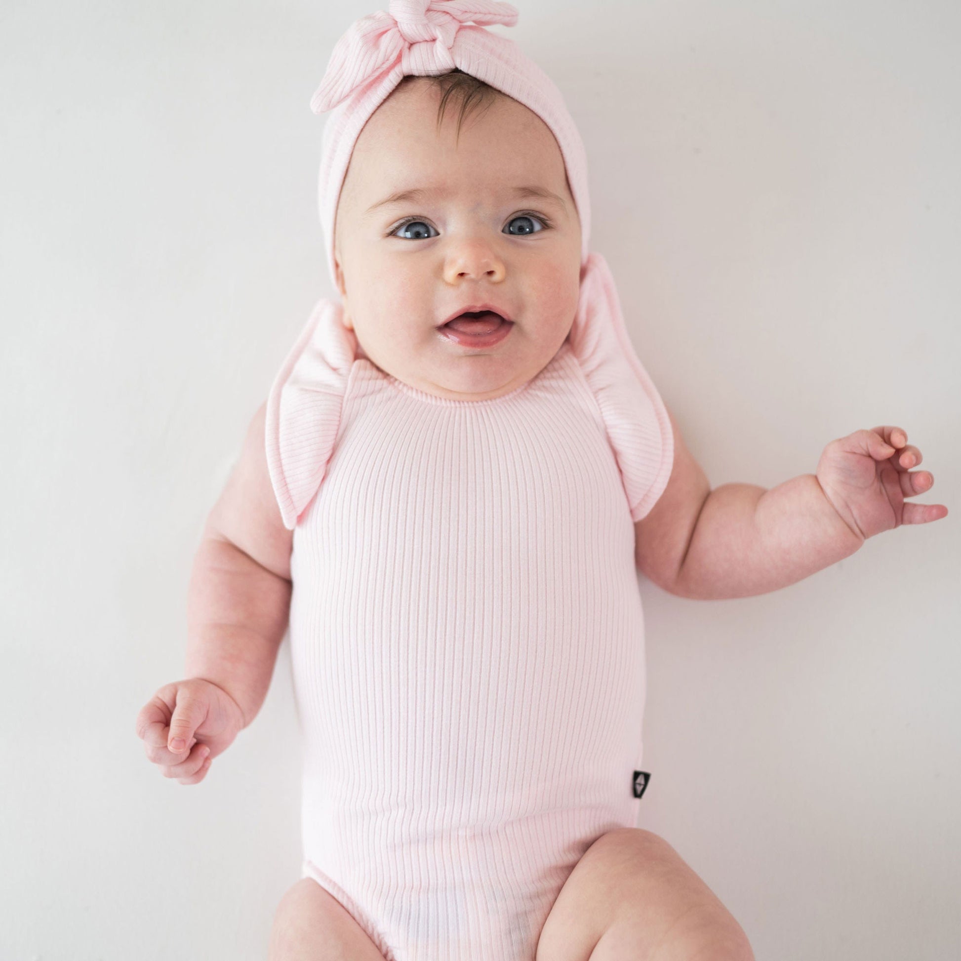 Kyte BABY Ribbed Sleeveless Ruffle Leotard - Sakura
