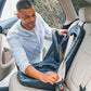 Dad installs base of Chicco Fit360 ClearTex Rotating Convertible Car Seat - Black