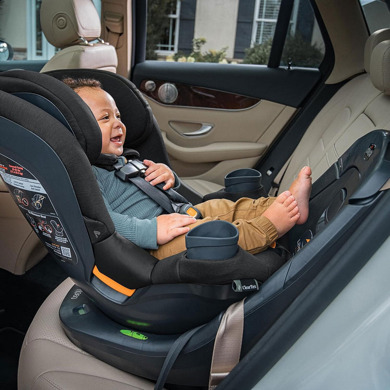 Baby riding rear facing in Chicco Fit360 ClearTex Rotating Convertible Car Seat - Black