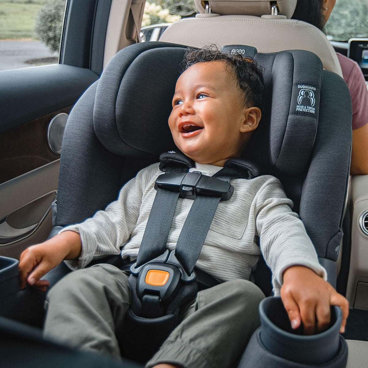 Baby riding rear facing in Chicco Fit360 ClearTex Rotating Convertible Car Seat - Black
