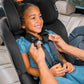 Parent buckles girl into Chicco Fit360 ClearTex Rotating Convertible Car Seat - Black