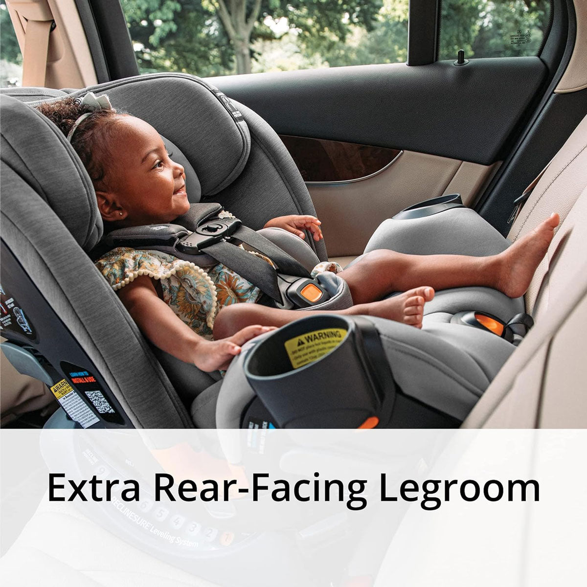 Baby rides rear facing in Chicco OneFit ClearTex All-In-One Car Seat - Drift