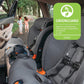 Kids play at park in the background with Chicco OneFit ClearTex All-In-One Car Seat - Drift and Slate installed in vehicle
