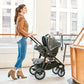 Woman pushing Chicco Corso LE Modular Travel System - Hampton