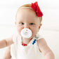 Baby girl sucks on Ryan and Rose Flat Cutie PAT Pacifier 2 Pack - Grey / White