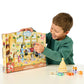 Boy opens door of Moose Toys Bluey Advent Calendar - Christmas Swim