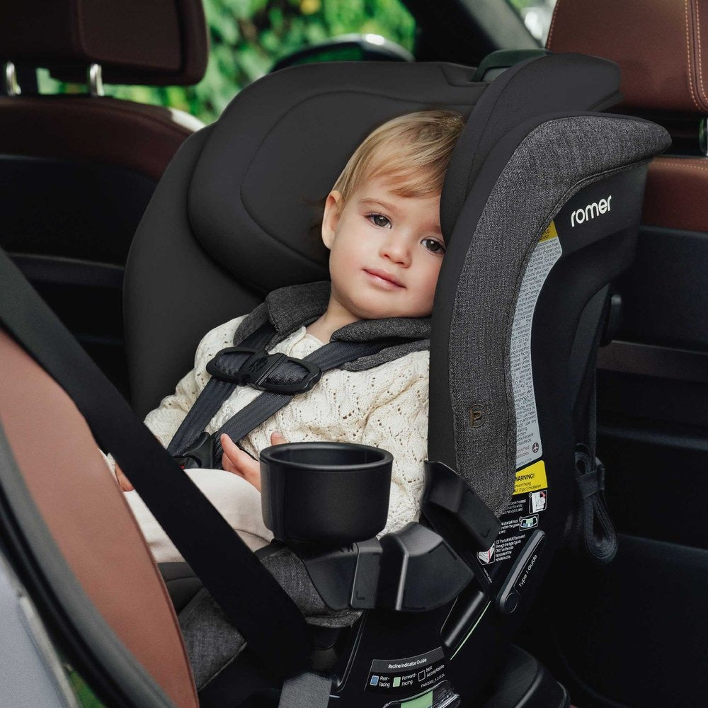 Toddler sits rear facing in Romer Veni Convertible Car Seat - Peppercorn