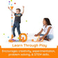 Two kids watch balls pop out of Fat Brain Toys Air Toobz
