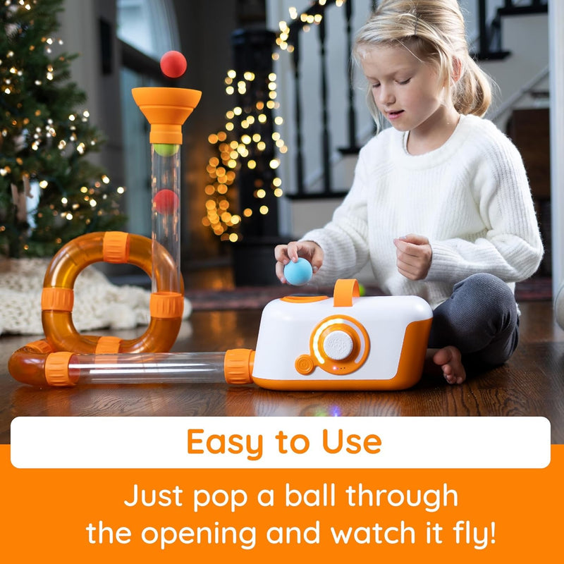 Little girl plays with Fat Brain Toys Air Toobz