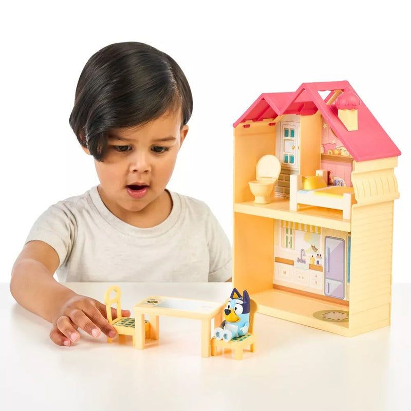 Child playing with Moose Toys Bluey Mini Home Playset