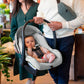 Dad carries baby in car seat of Maxi-Cosi Zelia2 Luxe+ 5-in-1 Travel System with Mico Luxe+ - Arctic Frost