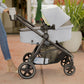 Mom pushes baby in bassinet mode of Maxi-Cosi Zelia2 Luxe+ 5-in-1 Travel System with Mico Luxe+ - Arctic Frost