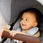 Baby rides in Maxi-Cosi Zelia2 Luxe+ 5-in-1 Travel System with Mico Luxe+ - Arctic Frost