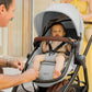Baby riding in stroller of Maxi-Cosi Zelia2 Luxe+ 5-in-1 Travel System with Mico Luxe+ - Arctic Frost