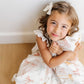 Little girl snuggles Saranoni Receiving Minky / Lush Blanket - Bows